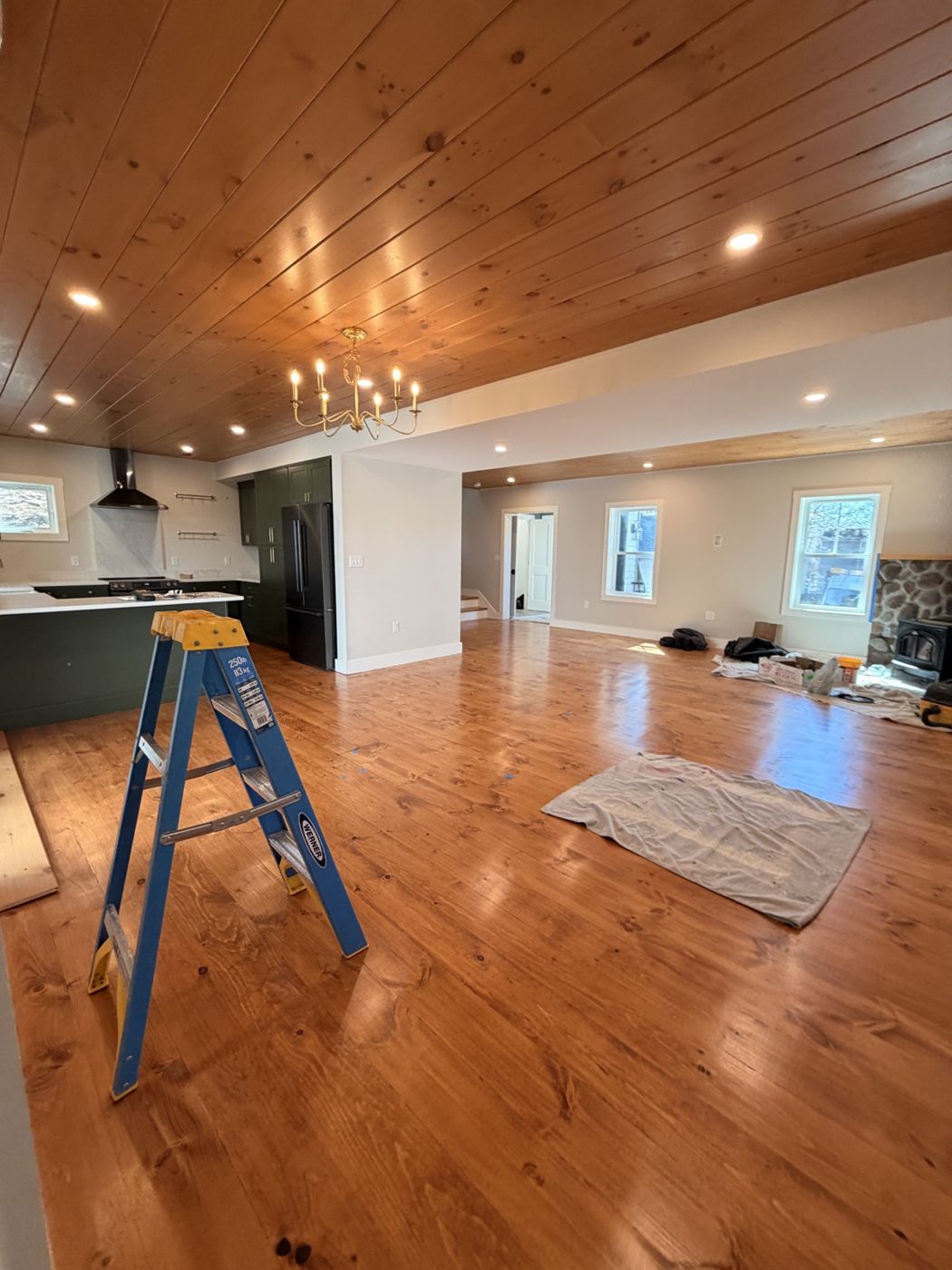 Finished open-concept living room and kitchen